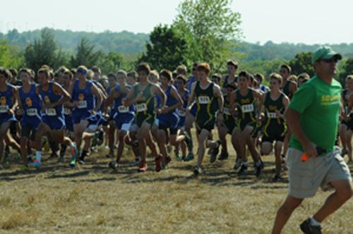 Last years cross country team prepares for a meet. photo by Mike Abell