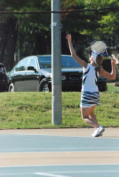 On her toes, junior Emily Anderson hits and returns the ball back to her opponent. Anderson was one of the top varisty players on this years tennis team.
