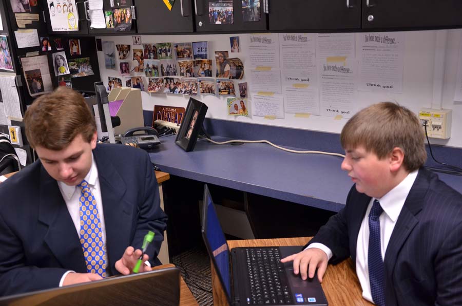 During a debate at Blue Valley High School, Sophmore Franklin Carter and Senoir Nels Carlson look through their documents to find the best suited opposition to the opposers reasoning. Debating about alternate fuel resources in Mexico, they discuss whether its right to help fund it.