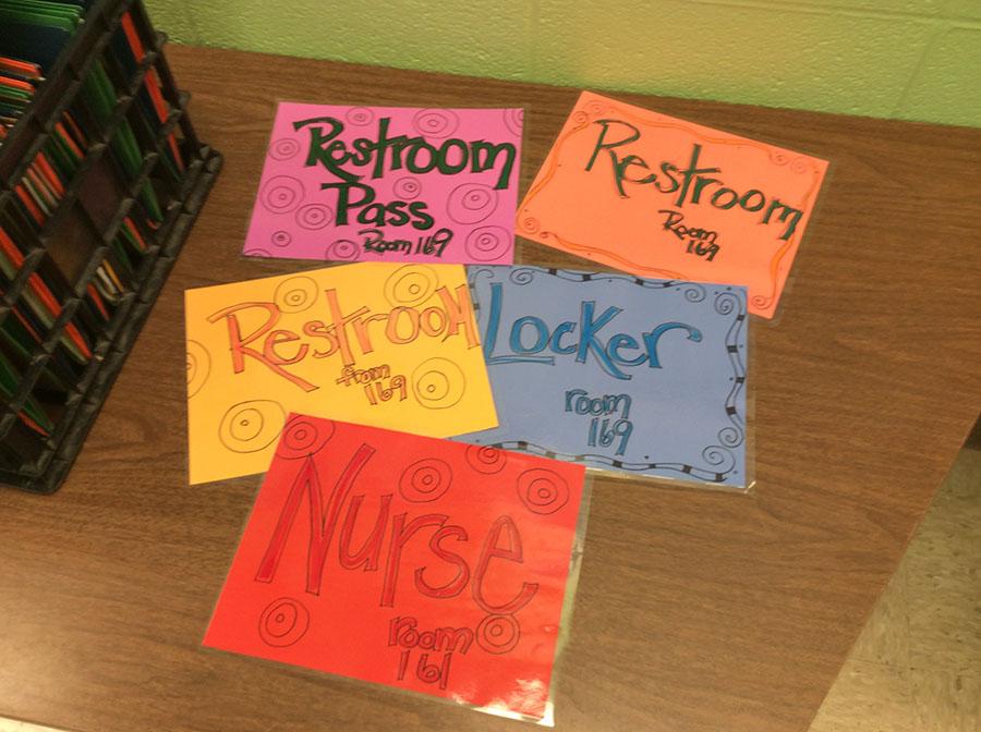 Colorful hall passes designed by para Joyce Pennington used in special education teacher Lisa Ross classes.