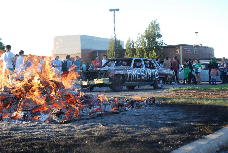 As per tradition, there was a homecoming bonfire with a car for students to smash. The car was decorated with the name and colors of the opposing team.