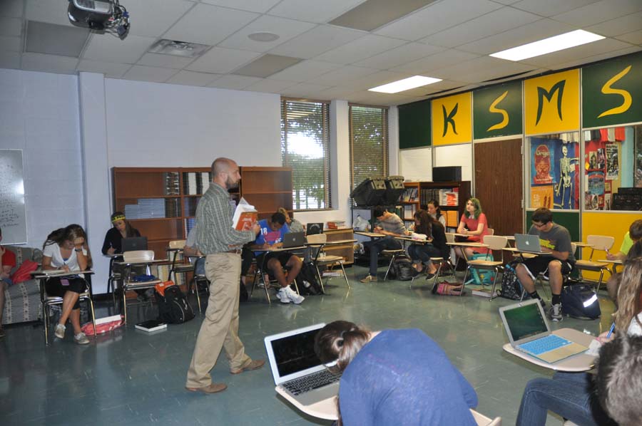 Getting prepared for the presentations Mr.Gatewood gives directions to students as they get ready to take notes on famous literature.