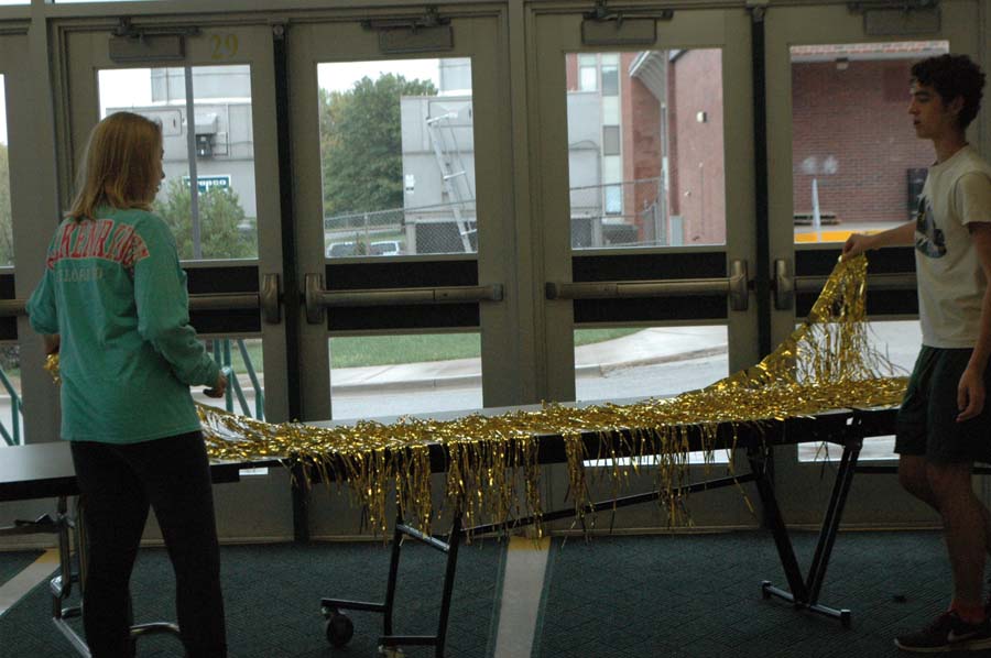 While setting up for homecoming, Senior Isaac Lanan and Junior Emily Wollard decorate the auxilary gym lobby to match the 1920s theme. This years theme for homecoming drew in a crowd of over 400 people, one of the largest crowds ever! 