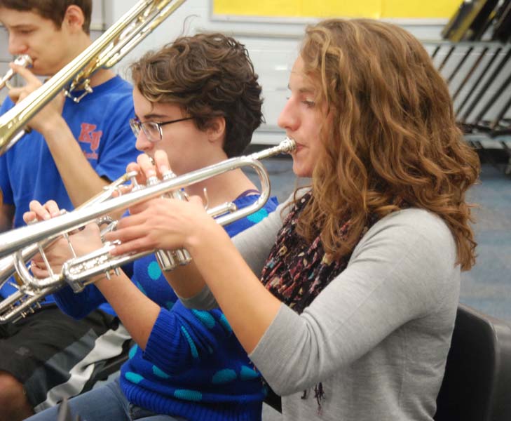 Playing away on her trumpet senior Megan Stollsteimer rehearses with the pit for the Souths fall play Pippen. The pit was composed of both brass and string instruments with three drummers.