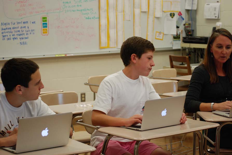 Focusing hard, Sophomore Daniel Lopez and Freshman Harrison Polen stay after school for late night to finish working on there story's for the yearbook. After every deadline the yearbook staff has, students from the staff stay for a late night with Mrs. Fales to work on their work and finish and profect it.