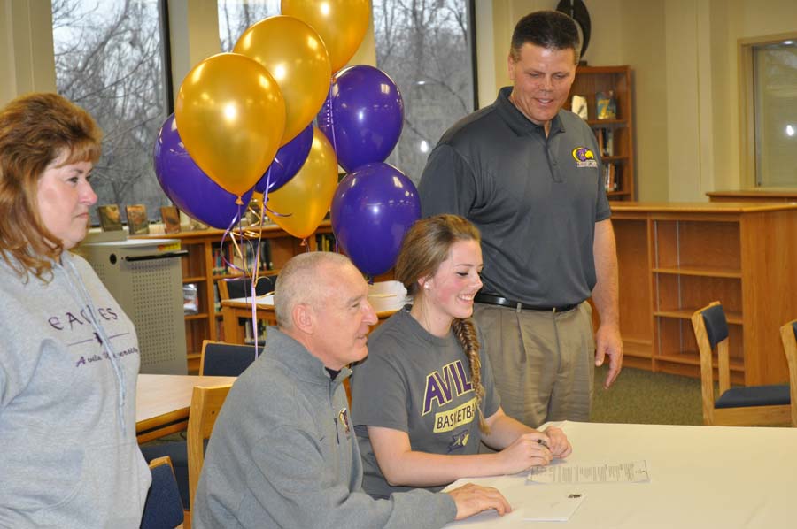 Nikki Norton is accompanied by her parents and her future coach as she makes her commitment to Avila University where she will continue to play basketball beyond her high school career.