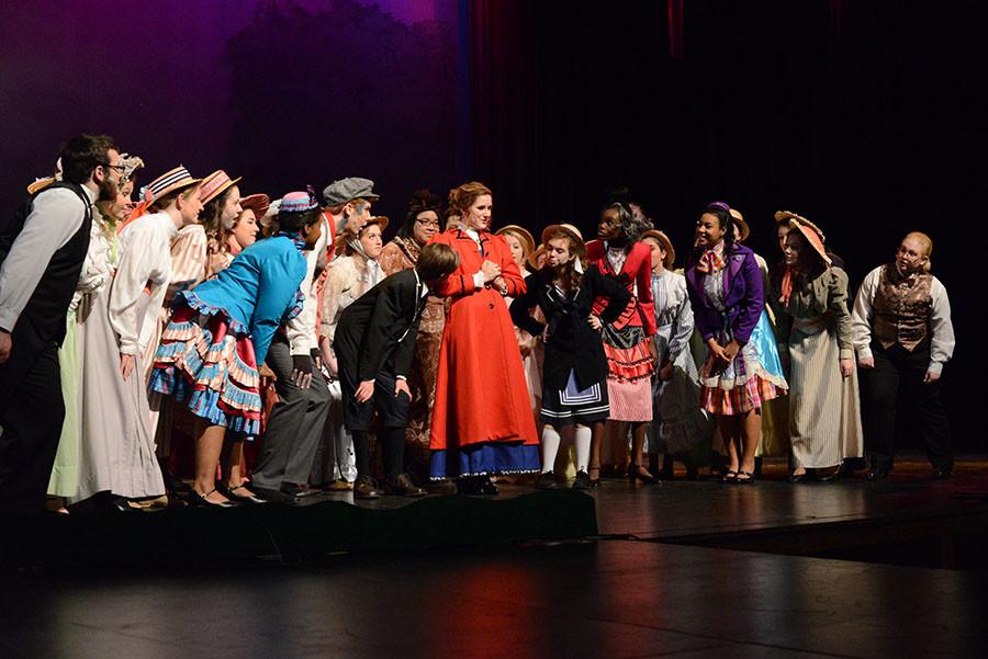 Gathered around rose smithson the cast of marry poppins sings supercalifragilisticexpialidocious