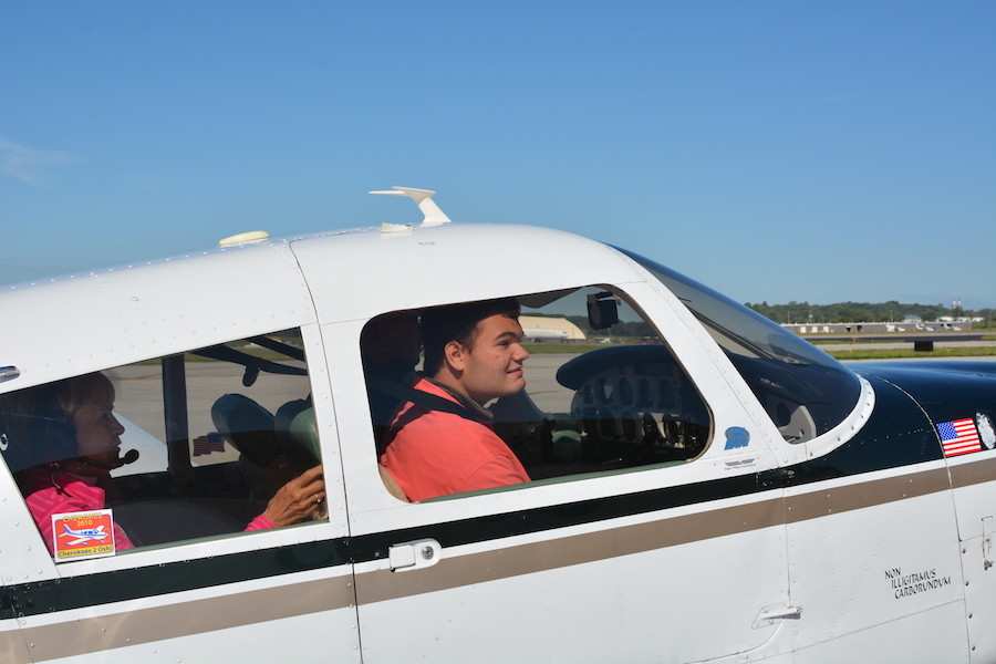 Sitting in the plane, sophomore Wesley Hansen prepares to take off for a 30 minutes plane ride. This was Hansens fifth time riding in a plane through challenge air. 