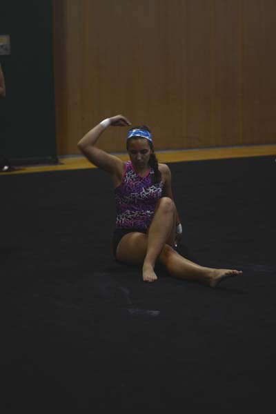 Senior Isabel Holcomb, trys to figure out an ending to her floor routine. Tara helped her out and gave her a grand finale.
