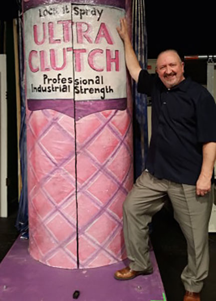 Theatre Director Mark Swezey next to Ultra Clutch can. photo by Lydia Thorn