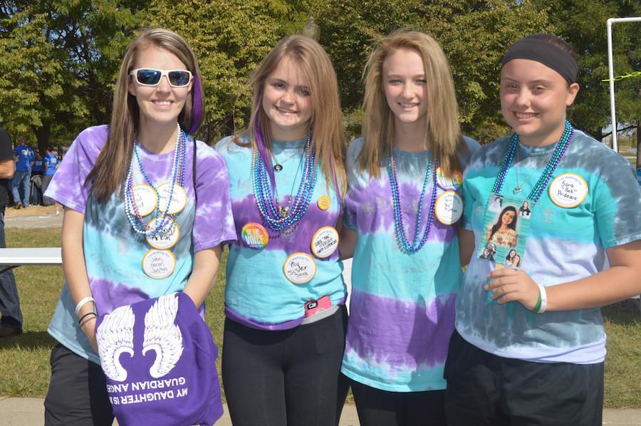 A group of South students made T-shirts and walked 3 laps to support the out of the darkness suicide prevention walk in honor of Sara Prideaux. Photo by Claire Johnson