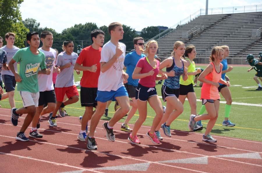 The 2015-2016 cross country team starts practice together with laps around the track. 