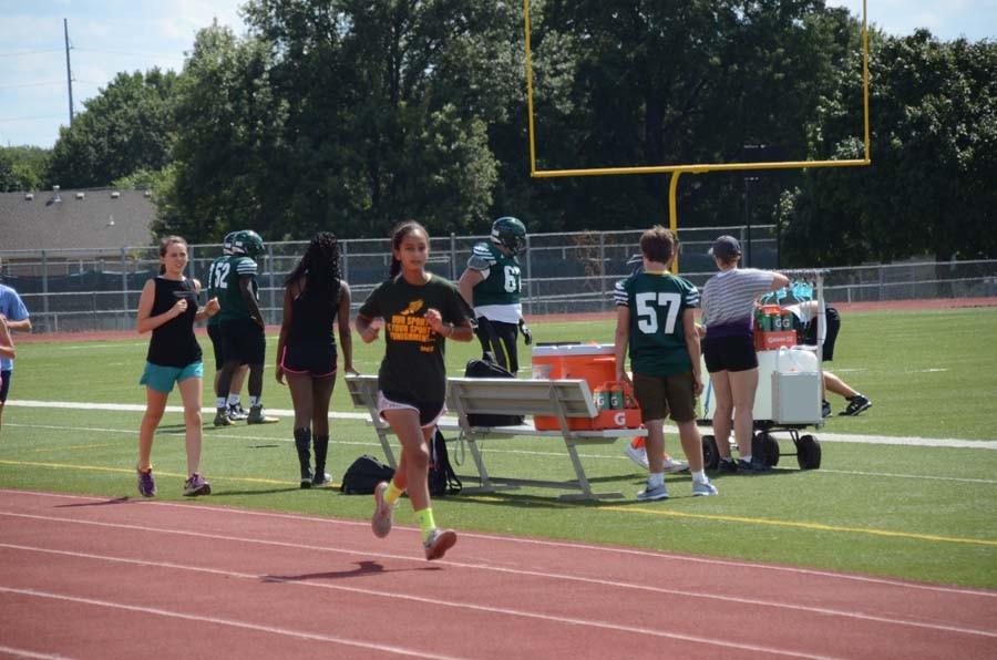 Sophomore Saba Levendusky mid-stride as she runs around the track.