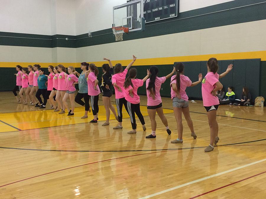 Varsity dance team works on their counts, trying to perfect the opening ripple.