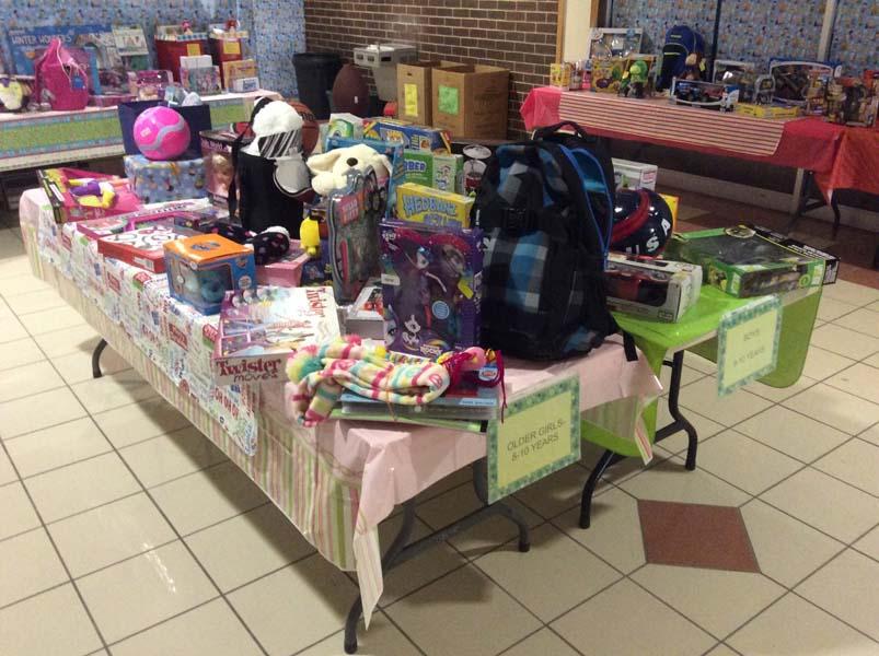 A table is packed with lots of toys awaiting distribution at the Christmas Bureau. photo by Andrew Symonds
