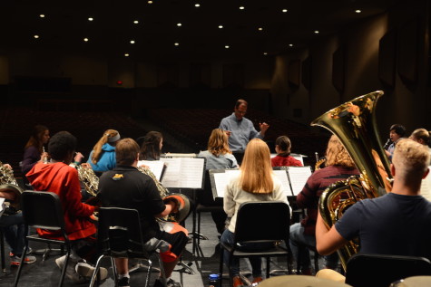 The symphonic band practices on the auditorium stage for the upcoming concert.