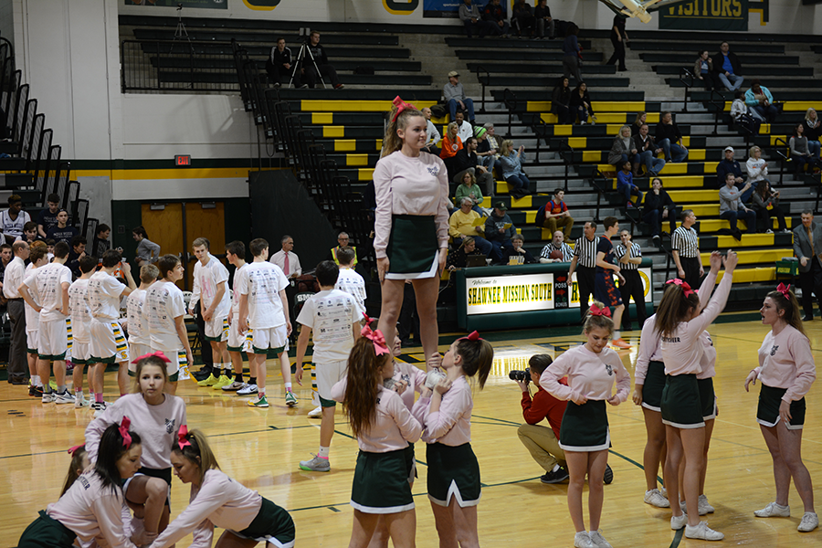 Varsity cheerleaders wear their pink shirts in support for the Pink Out game  Feb. 9.