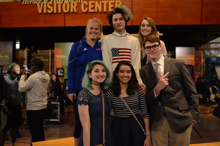 After placing second in the semifinals competition, Louder Than a Bomb team of senior Adric Tenuta, sophomore Tara Philips, senior Emily Wilkinson, junior Cinthia Romo and senior Andrew Duffy  pose for a picture with their Coach Caroline Ewing.