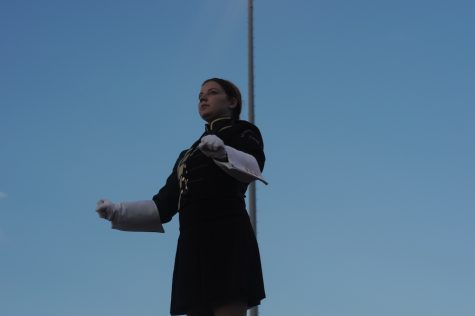 Drum Major Jocelyn Clark conducts the Rompin' Stomping' Raider Band's pregame show.
