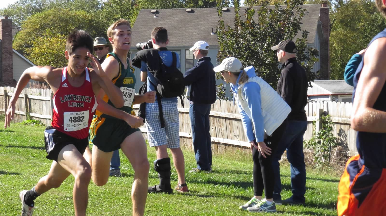 Senior Ben Stophel surges to pass a Lawrence High School runner. Stophel placed 12th at the Shawnee Mission Northwest Regional meet.