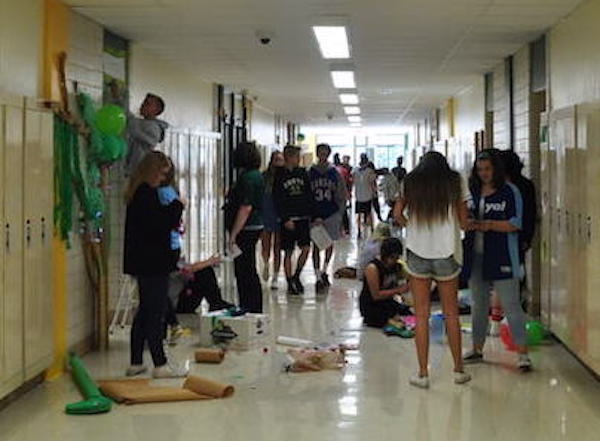 Students go out into the hall to decorate their doors during advisory Thursday, Sept. 29 of Homecoming Week.
