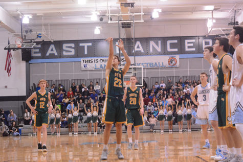 After being fouled, senior Isaac Soares shoots a free throw, he made the shot and furthered the lead south held against East. 