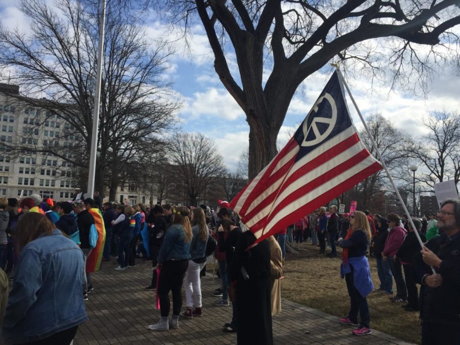 Protesters gather at the Kansas Capitol in Topeka for the anniversary of the Womens March on Washington. About 400 people showed up and marched. Photo by Megan Smith