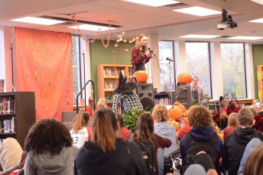 Performing a poem, junior Maddy Ramsay performs at the fall poetry festival.