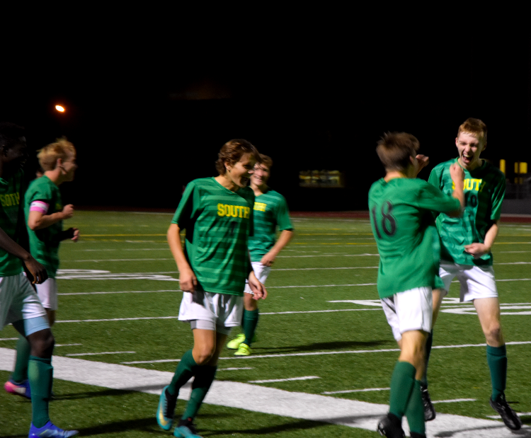 The Raiders celebrate during their game. The Varsity boys defeated the Olathe North Eagles 4-2 on Monday, Oct. 22.