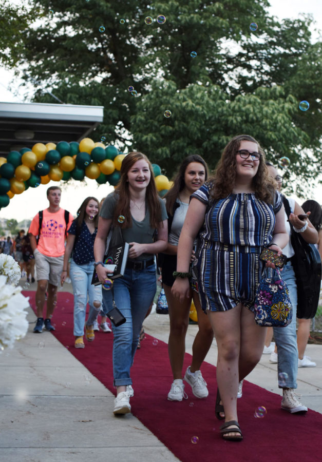 South students walk down the red carpet in the courtyard on the first day of school. They were welcomed by cheer, pace, drumline and teachers.