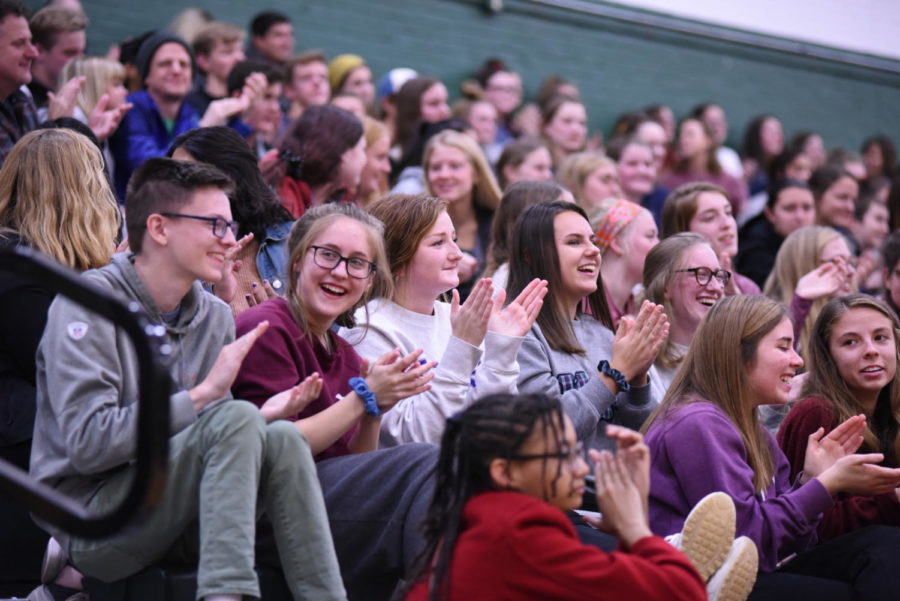 The crowd laughs and applauds a joke made by a contestant in the Mr. AmeriCAN pageant. The pageant was an event held by student council to raise cans and money for the community.