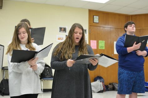 Students rehearse for the Masterworks concert. They use no music since they are in the a capella choir. 
