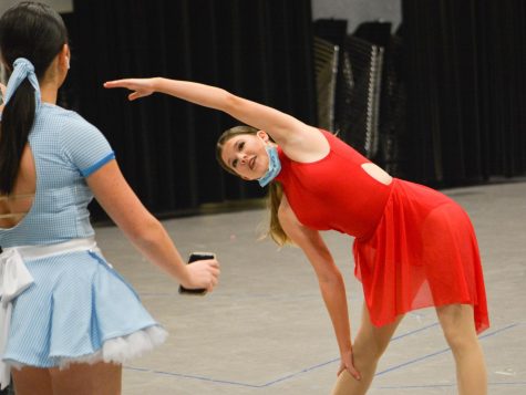 Before competing, senior Katie Parks warms up backstage at ONWHS.