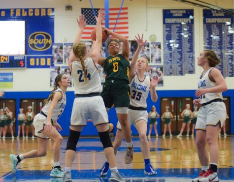 Going in for the shot, Sophomore Joycelyn Moore pushes past the other team to shoot. Ive been playing since third grade, its like a getaway from stuff Moore said. Raiders are currently 11-4 in their season.