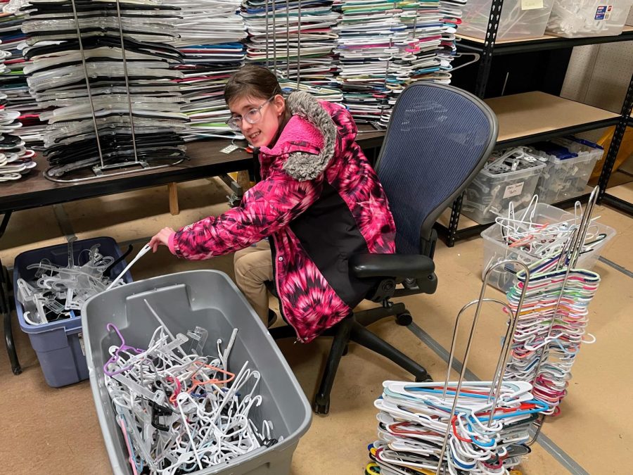 Tackling the never-ending task of sorting hangers, Sierra Pauli works at the SMSD Clothing Exchange. 
