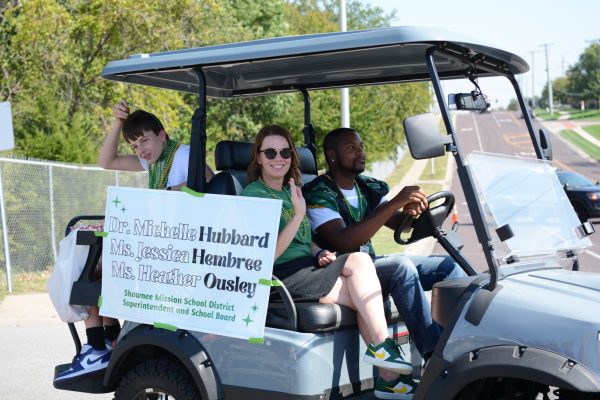 Jessica Hembree rides with her son in the Homecoming parade on Sept. 29, 2023. Spanish teacher Patrick Grant drove Hembree in the parade.