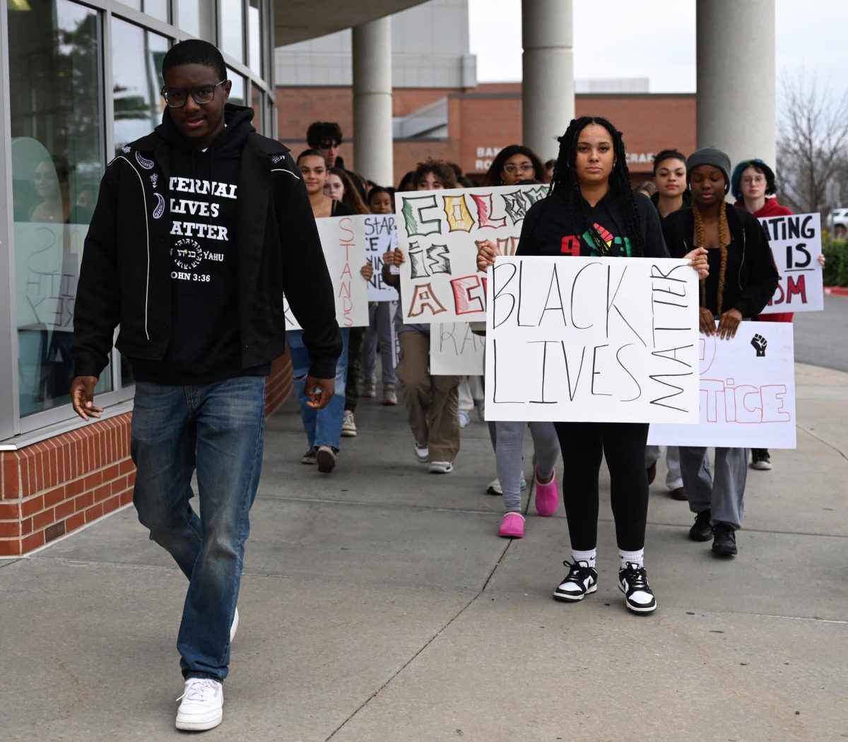 Senior Ace Cofield and junior Ava Harris lead the walkout towards the SMSD district stadium field at South.