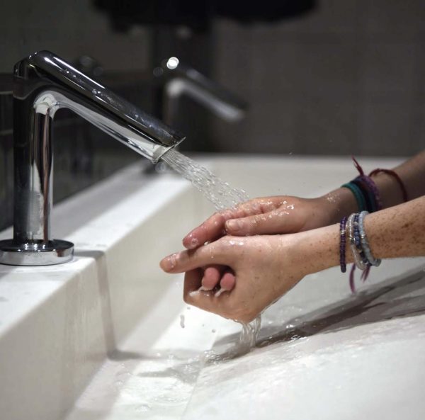 A student washes their hands in one of souths recently renovated bathrooms.