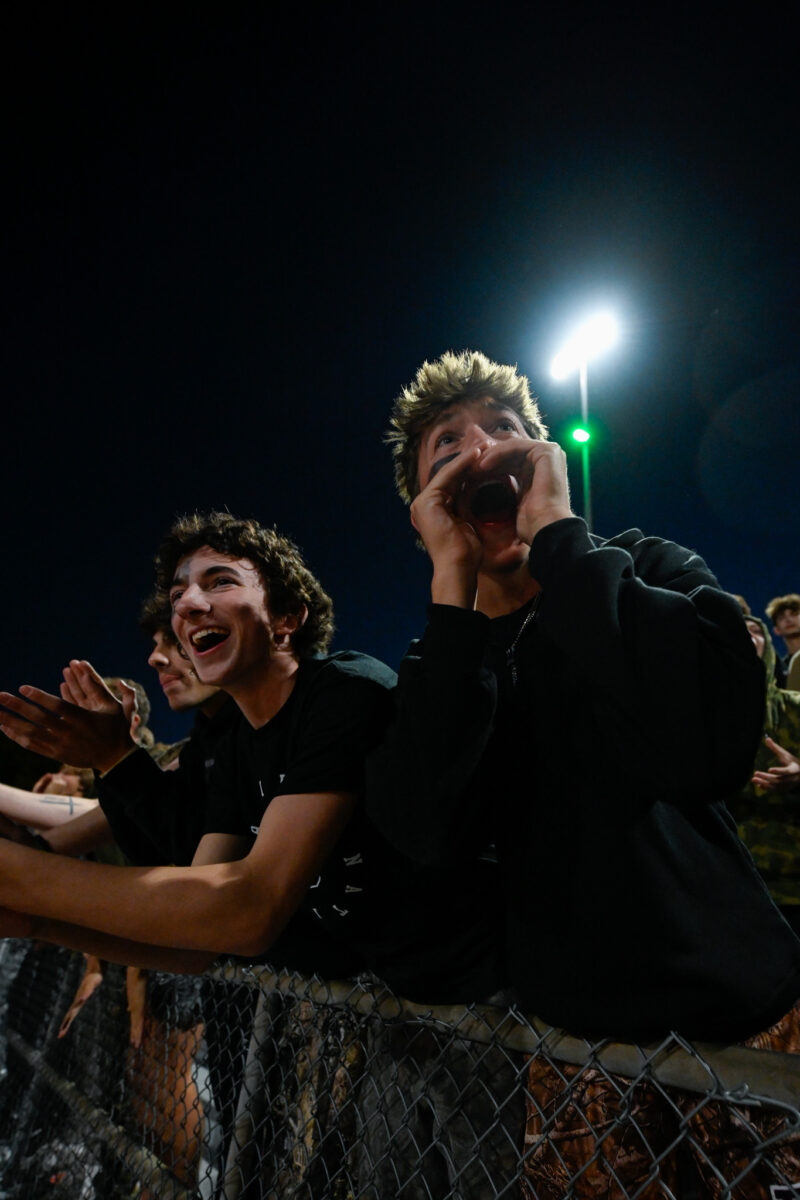 During Kickoff at the senior night game, Seniors Tyler Lawniczak and Kai Contreras get Loud to support the raiders football team in their game against Shawnee Mission NorthWest on October 25