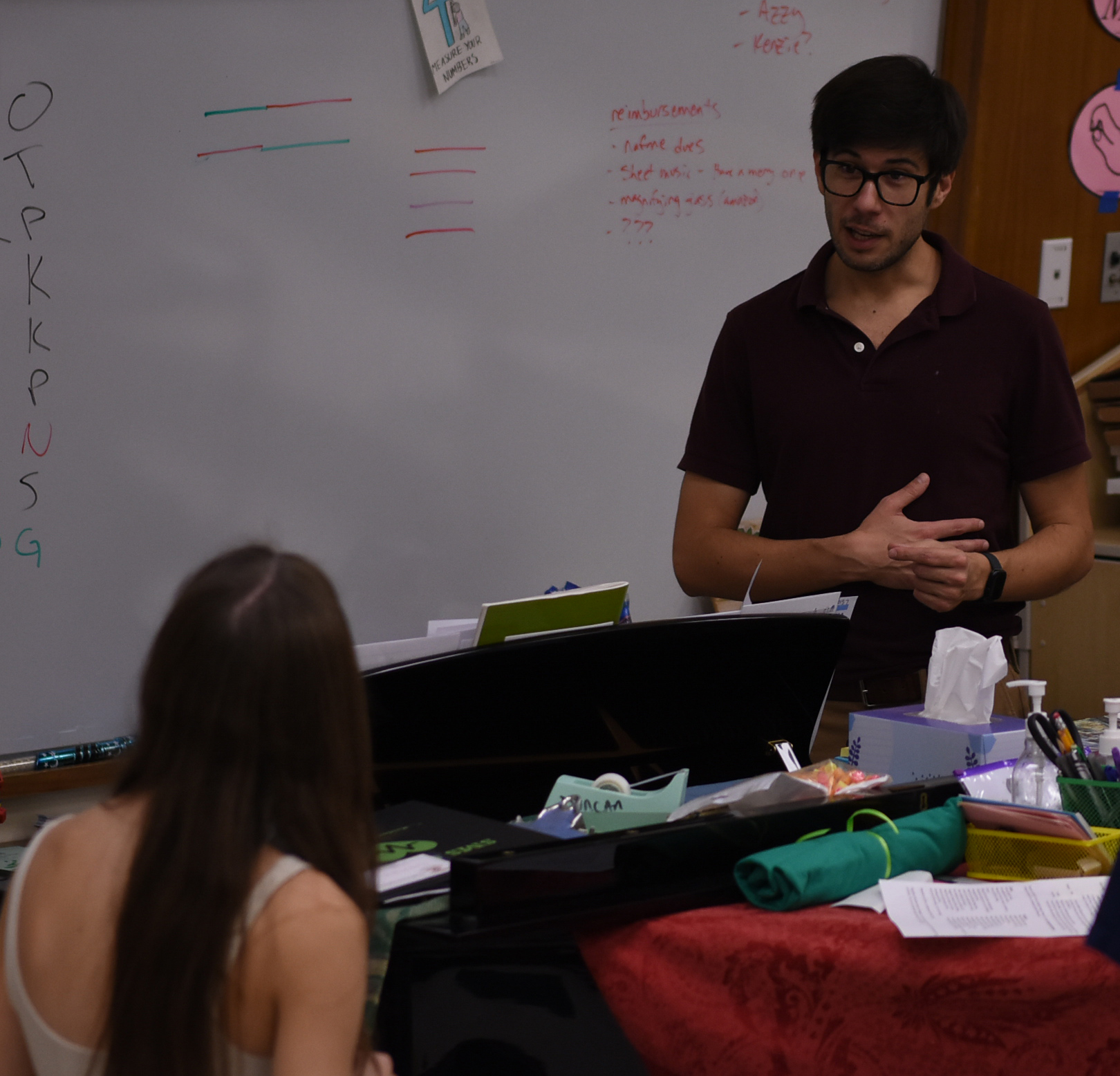 Guiding his students, choir teacher Jon Duncan answers freshman Samantha Wilson’s question during district audition prep. “It was a little bit scary. Honestly, I was just trying to memorize things and trying to breathe at the right times,” Wilson said. The treble choir practiced for their auditions on November 7 during class.