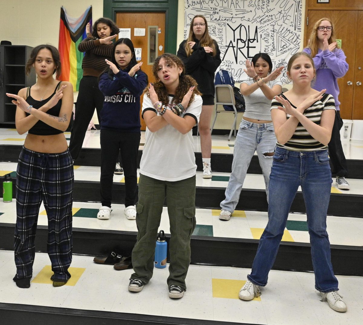 Preparing for Cabaret, junior Isabella Appleman leads the Treble choir in "Mama, Im a Big Girl Now"right before Camaret on November 5. Appleman and the treble choir practiced in the choir room, they practiced using facial expressions. " Izzys quote"