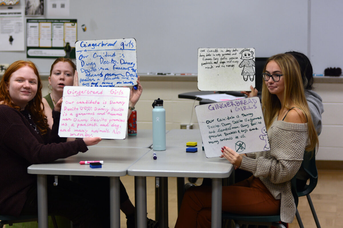 Students show their responses to the class game during second hour Latin 2 class.