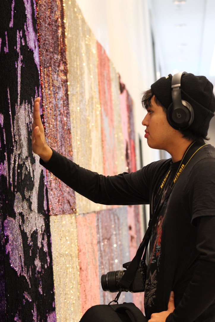 During the JEA/NSPA National High School Journalism Convention, SM South students went to the Fashion District mall to get coffee before their classes. Student photographer sophomore Sebastian Aburto played with a sequin wall in the mall.