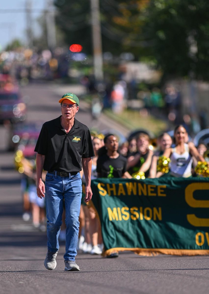 Band Director Steve Adams leads the rest of the SM South band in the October 4 Homecoming parade.