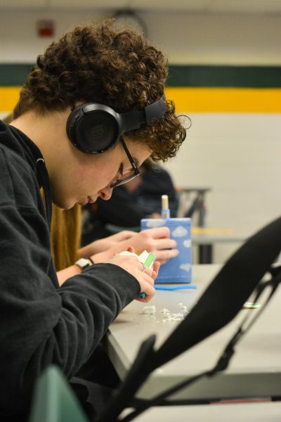 Working with his hands, sophomore Jaime Haas finishes up a project in engineering teacher Julie Conrad’s 2nd hour Intro to Engineering class. “Conrad does talk a lot, but [Intro to Engineering] is a relatively good class,” Haas said. “I like working with my hands and creating things.”