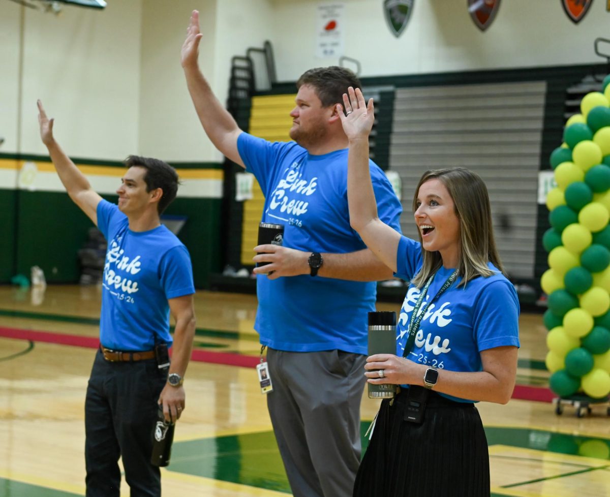 Associate Principals Kris Meyer, Jake Bauer, and Ben Richardson in the South auditorium welcoming Freshmen on their first day of school Monday, Aug 11th.