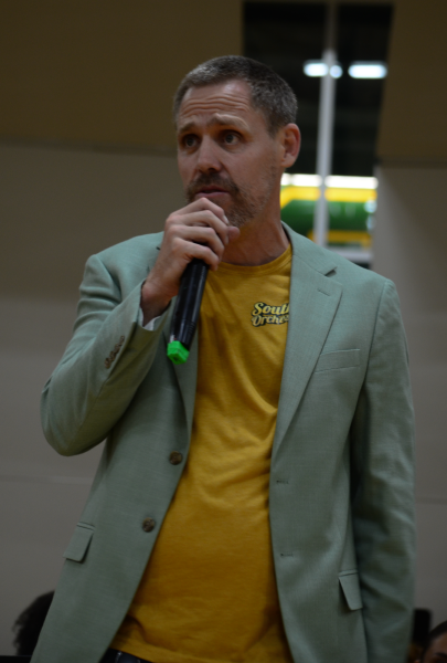 Director Jonathan Wiebe guides orchestra through the Oktober Fest performance.