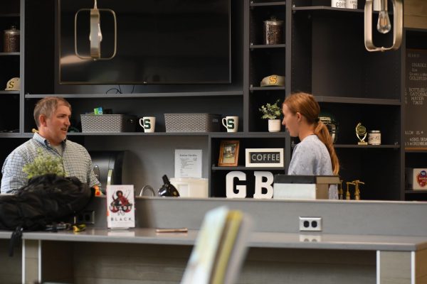 Senior Olivia Moody and sponsor Dustin Meyers get acclimated to the updated Green Bean space in early September, prior to their official opening on Sept. 3. photo by Luke Filipovits