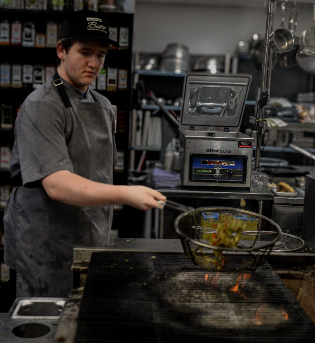 firing up some onions senior Linkin Shroeder is preparing onions to serve to customers for the rush on November 5th.