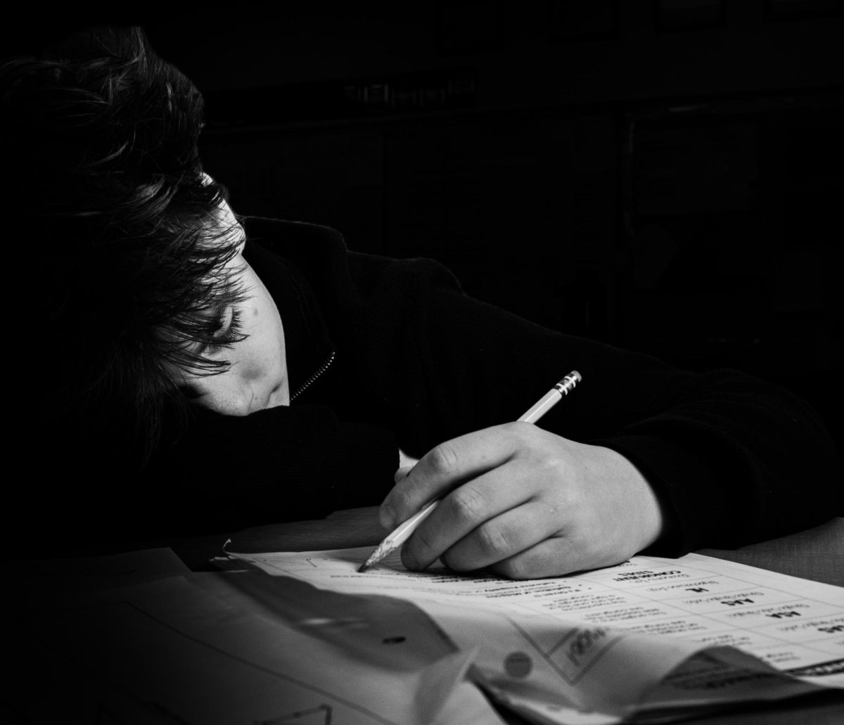 Student struggles through school work.
Photo Illustration